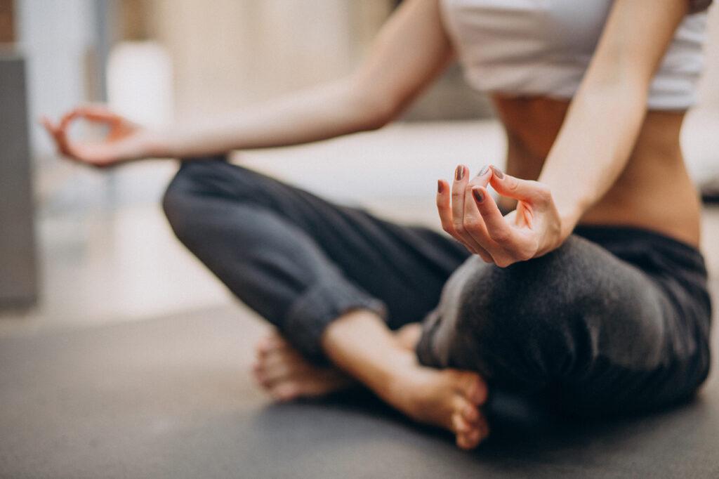 young-woman-practicing-yoga-home-
